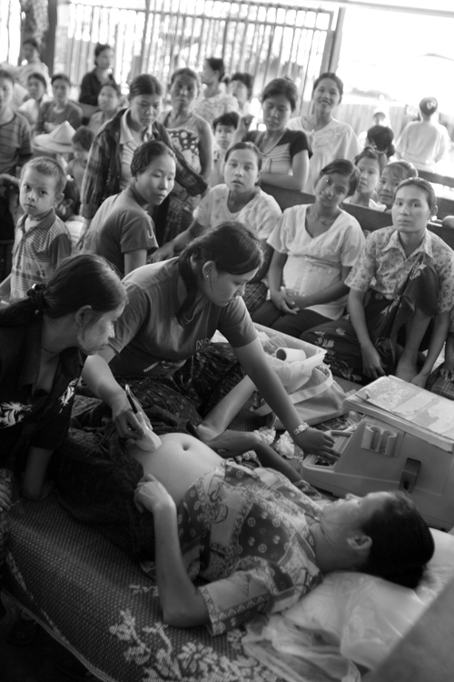SMRU Mawker Tai clinic on the bank of the Moi River, and the border between Burma and Thailand. Today mothers and expectant mothers receive ultra sound and blood tests for "on the spot" malaria diagnosis.